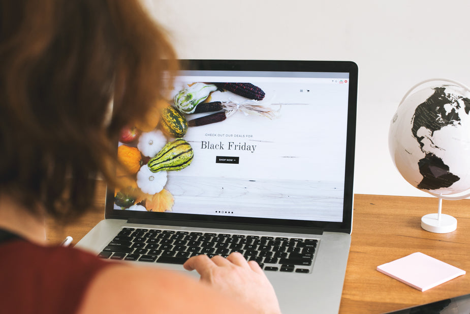 Woman browsing online sales for Black Friday and Cyber Monday with her online business.