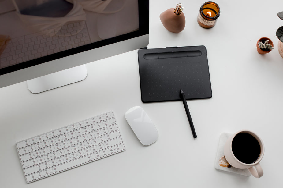 An overhead shot of a well organized desk.