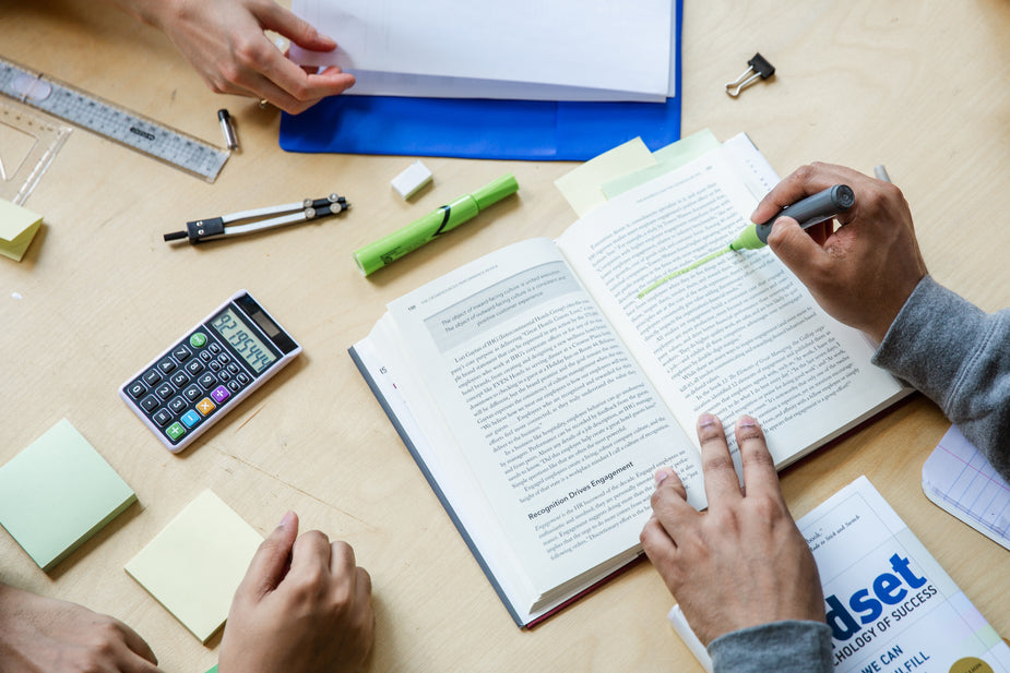 A group of three students gathered together to study and increase any learning opportunity they can for high school, university or other post-secondary education.