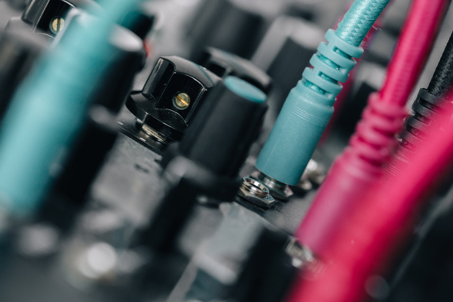 Extreme close up of soundboard plug ins & knobs, equipment for scopists, court reporters, and transcriptionists