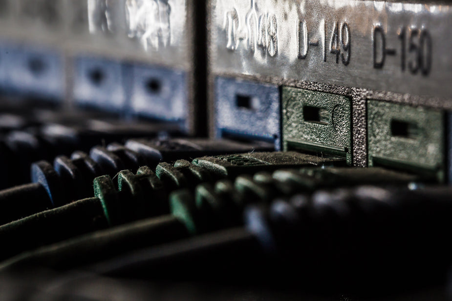 Close up of green and blue network and server cables.