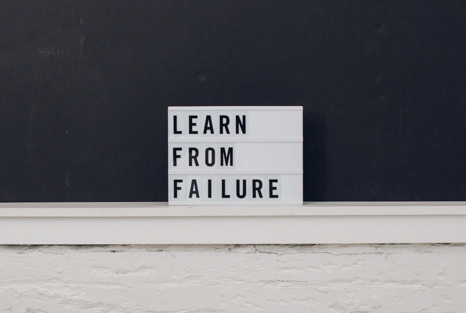 A small glowing light box with writing on it that says "Learn From Failure". Great advice for any of us. Best always to fail forward, or else you may get stuck behind your mistakes.