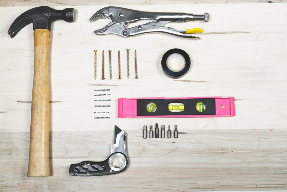 Tools and hardware lay in perfect order, ready for a DIY project.