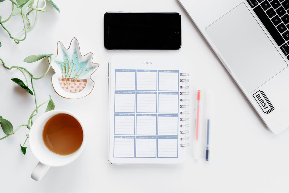 planner laid out on table to help avoid procrastination