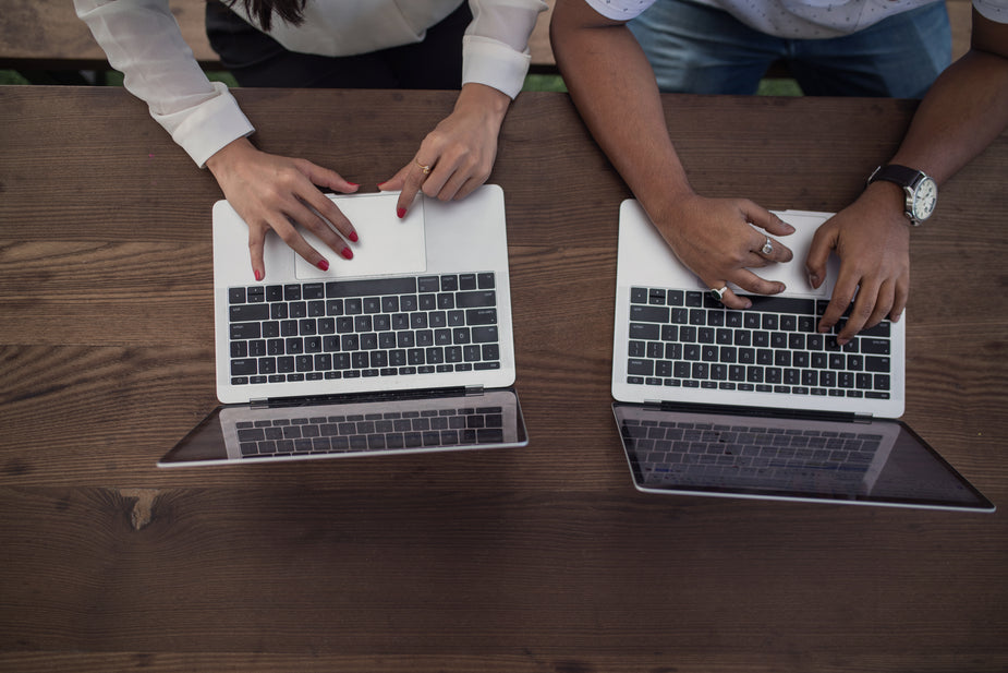 Jamming on laptops, coworkers sit side by side being as productive as possible in this modern workspace.