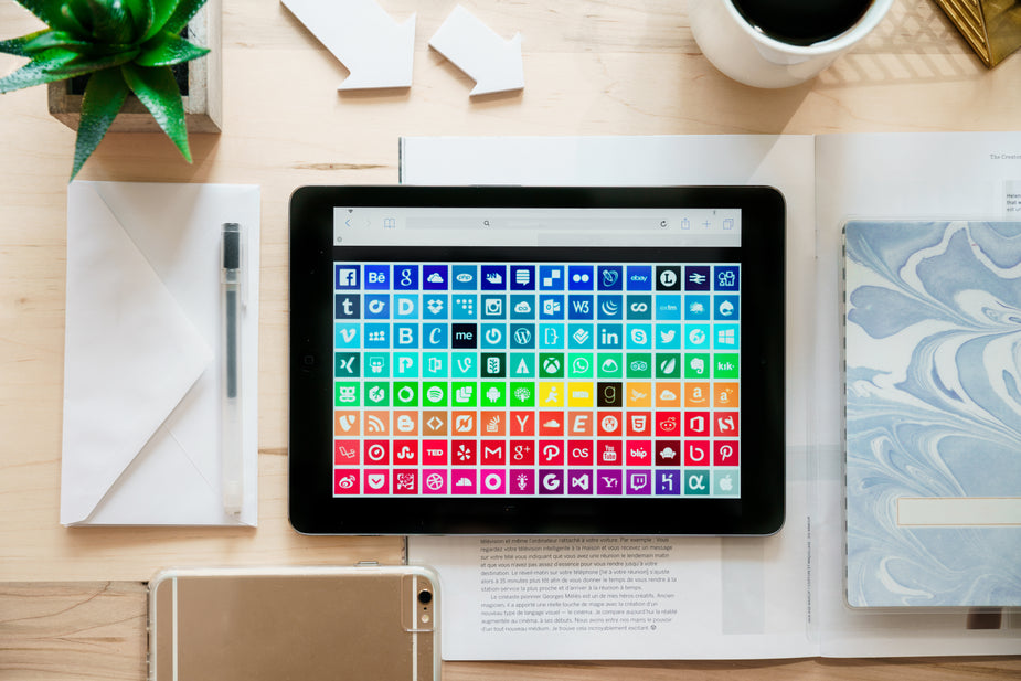 A flatlay image of a home office with tablet displaying ways to connect through social media and beyond! things you should know before becoming a scopist