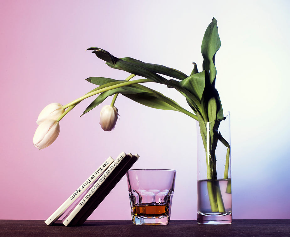 Tulips, a drink and books. Looks like someone is in for a night of dense literature.