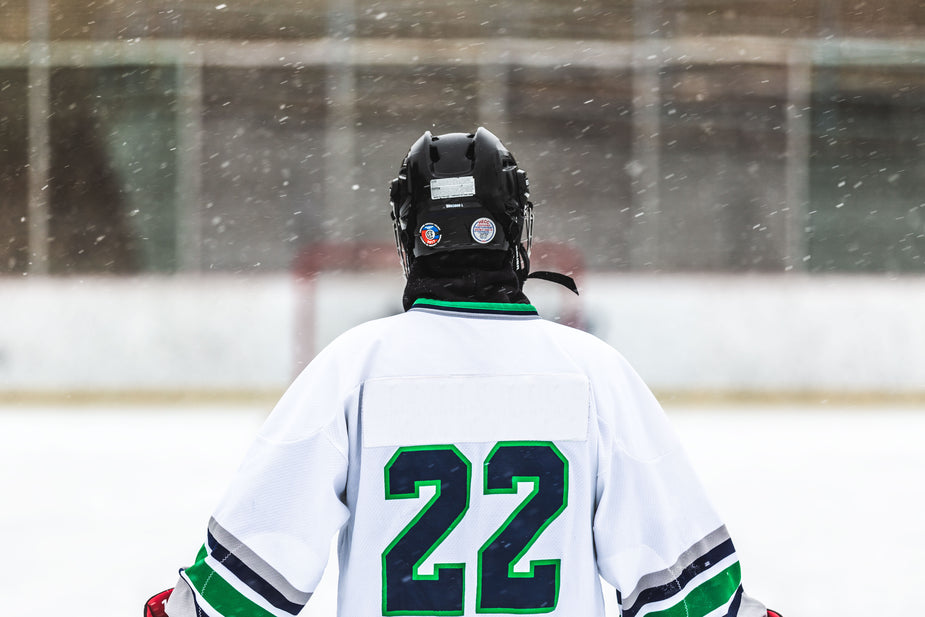 A hockey player skates down the empty ice, a big number twenty-two on their back. This is where they feel like everything is okay. This is where they feel free.