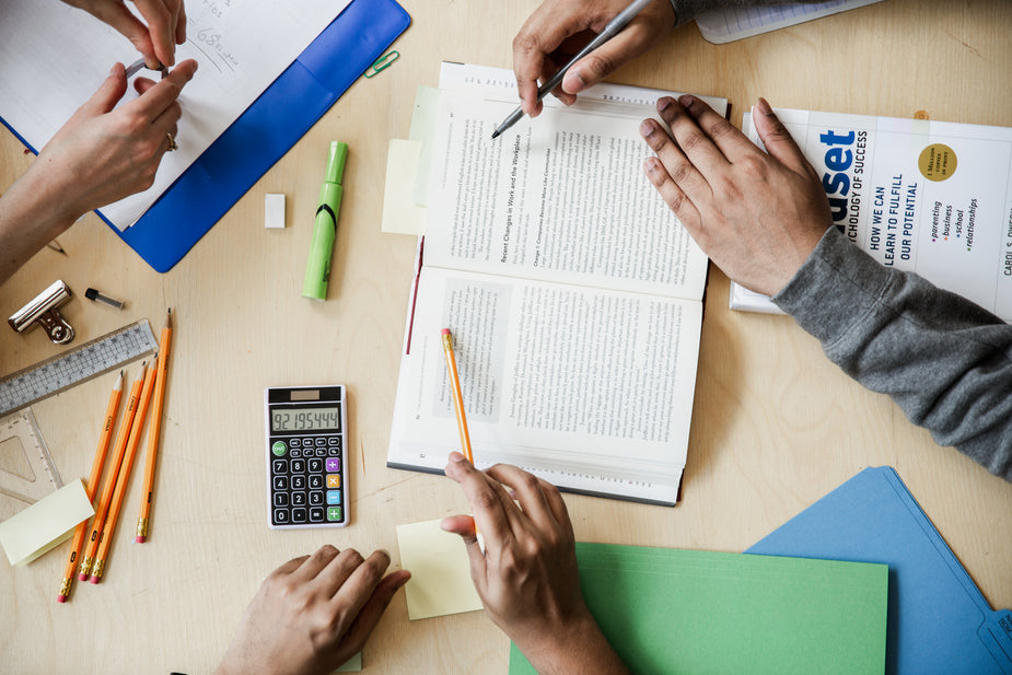 Four students are getting their study on. Textbooks, highlighters, pencils, calculators and more. Everything they need to get the higher education they deserve. LEARNING! metaphor for good relationship with court reporter