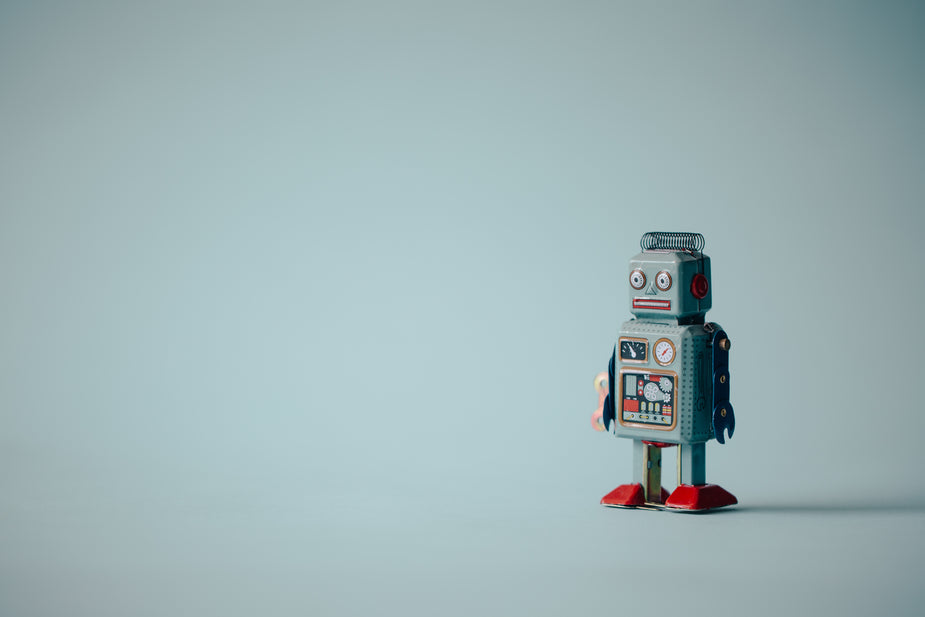 Portrait style look at a vintage toy robot. Metaphor for AI