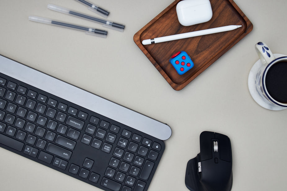 A desk flat lay perfect for the working from home professional, complete with the obligatory cup of black coffee. scoofer