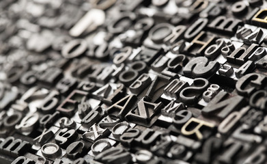 black and white letters Letterpress background, close up of many old, random metal letter English